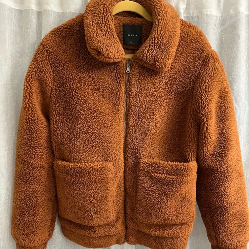 Puffy, baggy burnt orange teddy coat